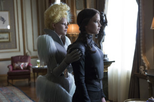 Effie Trinket (Elizabeth Banks, left) and Katniss Everdeen (Jennifer Lawrence, right). Photo by Murray Close