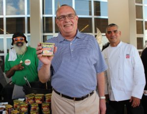 Tarrant Area Food Bank executive director Bo Soderbergh flanked by Keith Buttons and Manny Vasquez. Courtesy photos