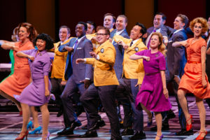 HTS 53 Joshua Morgan as Bud Frump and the Cast of How To Succeed Photo Credit Os Galindo e1478651882994