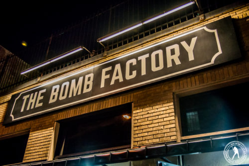 The outdoor sign for The Bomb Factory in Dallas, Texas