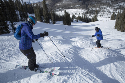 Two skiers on a slope in Purgatory, Colorado