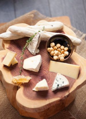 A charcuterie board from Rouge with multiples varieties of cheese.
