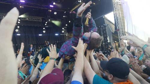 St. Paul of St. Paul and the Broken Bones singing while crowd surfing above the crowd at Austin City Limits, ACL, in 2016.