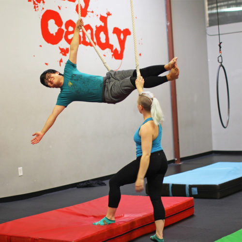 Instructor Julia Hornsby coaches a trapeze student. Photos by Brittney Rachelle Photography